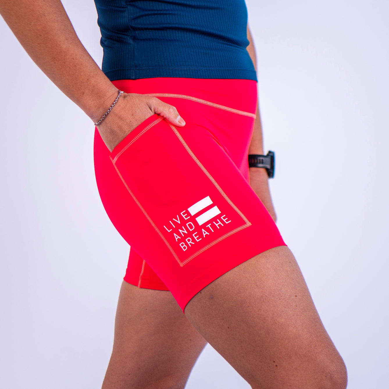 Coral Seamless Mid-Thigh Run Shorts